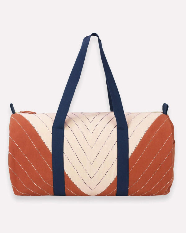 Triangle weekender bag from Anchal in rust, navy and cream colors.  