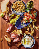 Table of chickpeas, tomatoes and hummus.