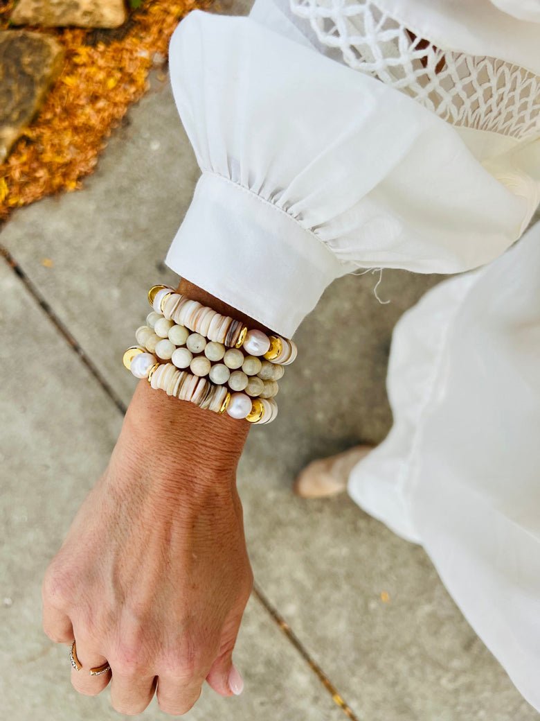 A beautiful shell stacker bracelet from Etoiled as a gift for her.