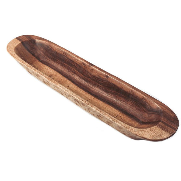 A long handmade wooden bowl from Sombreros by Greenheart is a lovely housewarming gift.