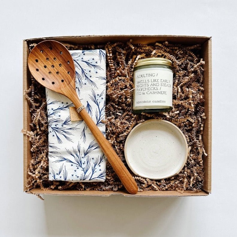 Beautiful wood spoon and handmade spoon rest paired with a winter tea towel and candle. 