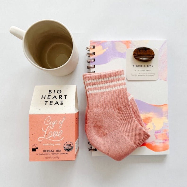 Moglea notepad paired with cute socks, tea, tiger's eye meditation stone and a cute mug make this a completely adorable gift.