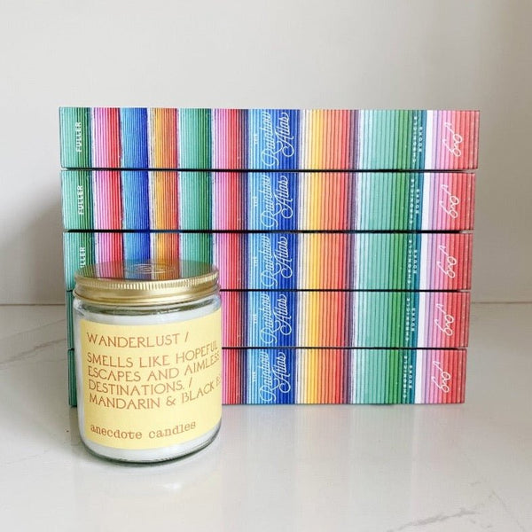 Rainbow Atlas paired with Wanderlust candle from Anecdote candle co. Perfect for the travel lover.