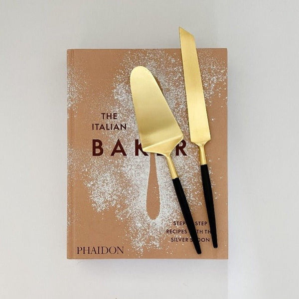 Beautiful gift set includes The Italian Bakery cookbook and black and cold cake set.