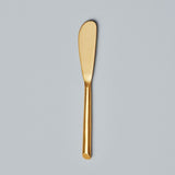 Be Home Matte gold spreader.  Pair this with any of our cutting boards for the perfect gift.